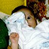 Cheyenne hiding behind a blankey