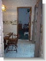 Kitchen looking into dinning and guest bedroom